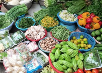 Stalls of fresh fruit and vegetables at a Vietnamese market
