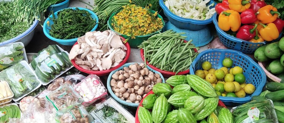 Stalls of fresh fruit and vegetables at a Vietnamese market