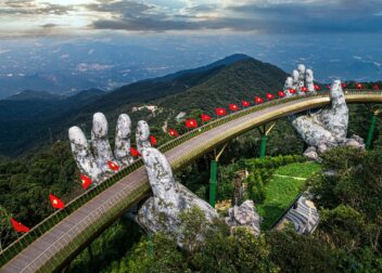 The Golden Bridge held up by giant stone hands at Ba Na Hills near Da Nang