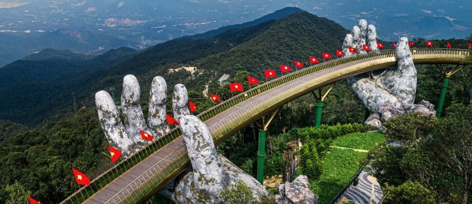 The Golden Bridge held up by giant stone hands at Ba Na Hills near Da Nang