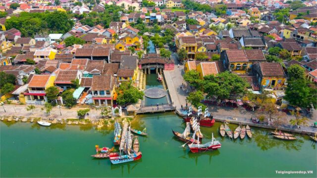 Aerial view of colorful Hoi An buildings, boats, and a canal in the heart of Vietnam’s Ancient Town.