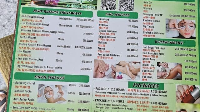 Spa service menu on a green board in Hoi An, listing body, facial, and nail services with durations and Vietnamese prices.