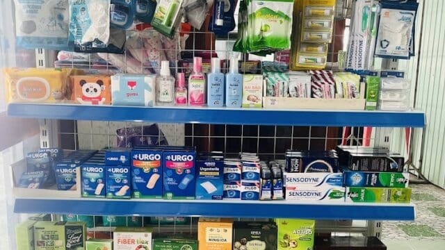 Shelves stocked with health, hygiene, and personal care products in a Hoi An store setting.