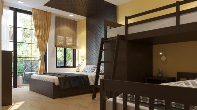 Modern Hoi An bedroom with a double bed, bunk bed, large windows, wood floor, and a yellow accent wall.