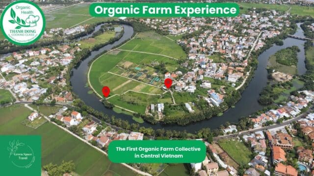 Aerial view of an organic farm collective near Hoi An, surrounded by fields, rivers, and houses in Central Vietnam.