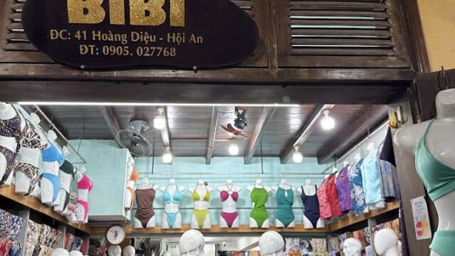 Mannequins in colorful dresses and swimsuits brighten the BiBi Cloth Shop, a popular boutique in Hoi An, Vietnam.