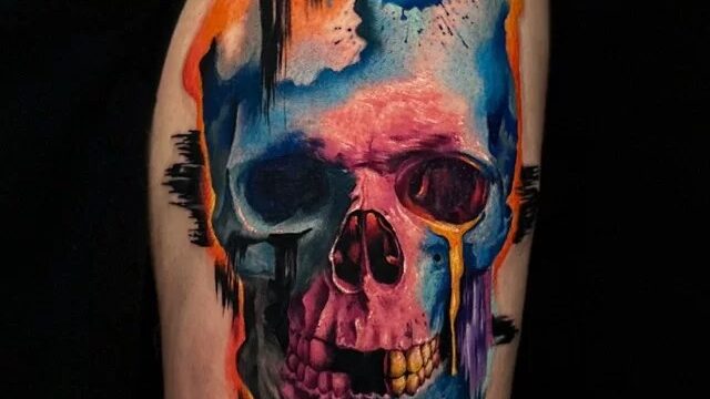 Vivid color watercolor skull tattoo by 1984 Tattoo & Piercing Studio, Hoi An