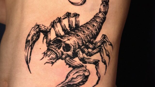 Detailed blackwork scorpion tattoo on a torso by Tattoo Station Hoi An